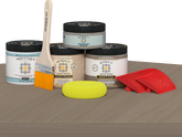 Retique It® Multi-purpose Wood'n Kit in Weathered Wood for interior top coat, showing a finished wood surface on a table.
