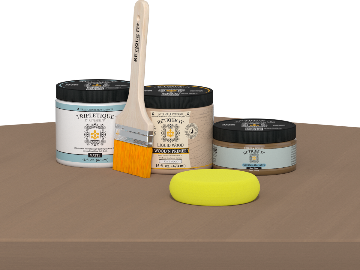 Retique It® Barn Wood Multipurpose Kit contents with Light Wood Liquid Wood primer, Barn Wood gel stain alternative, Tripletique matte interior top coat, paintbrush, and yellow sponge displayed on a wood surface.
