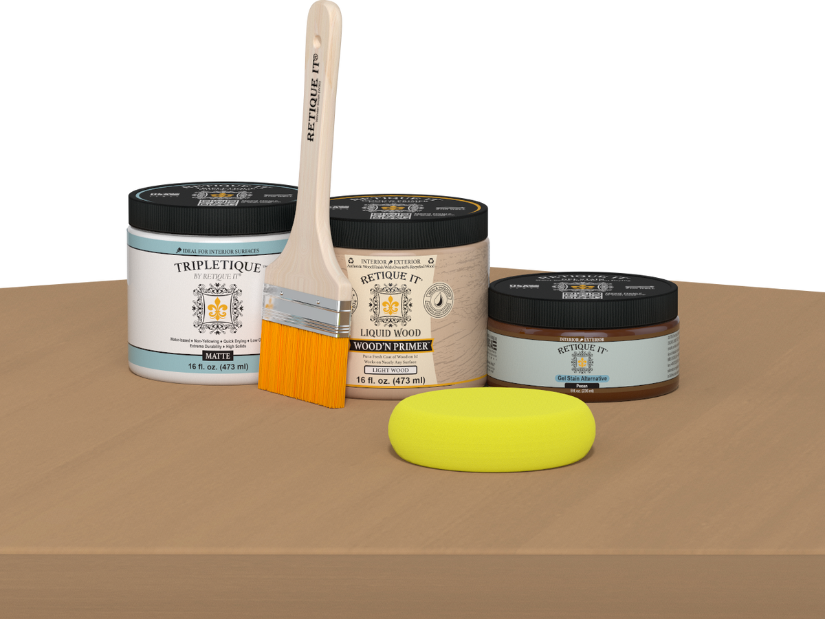Retique It® Pecan Multipurpose Kit contents with Light Wood Liquid Wood primer, Pecan gel stain alternative, Tripletique matte interior top coat, paintbrush, and yellow sponge displayed on a wood surface.