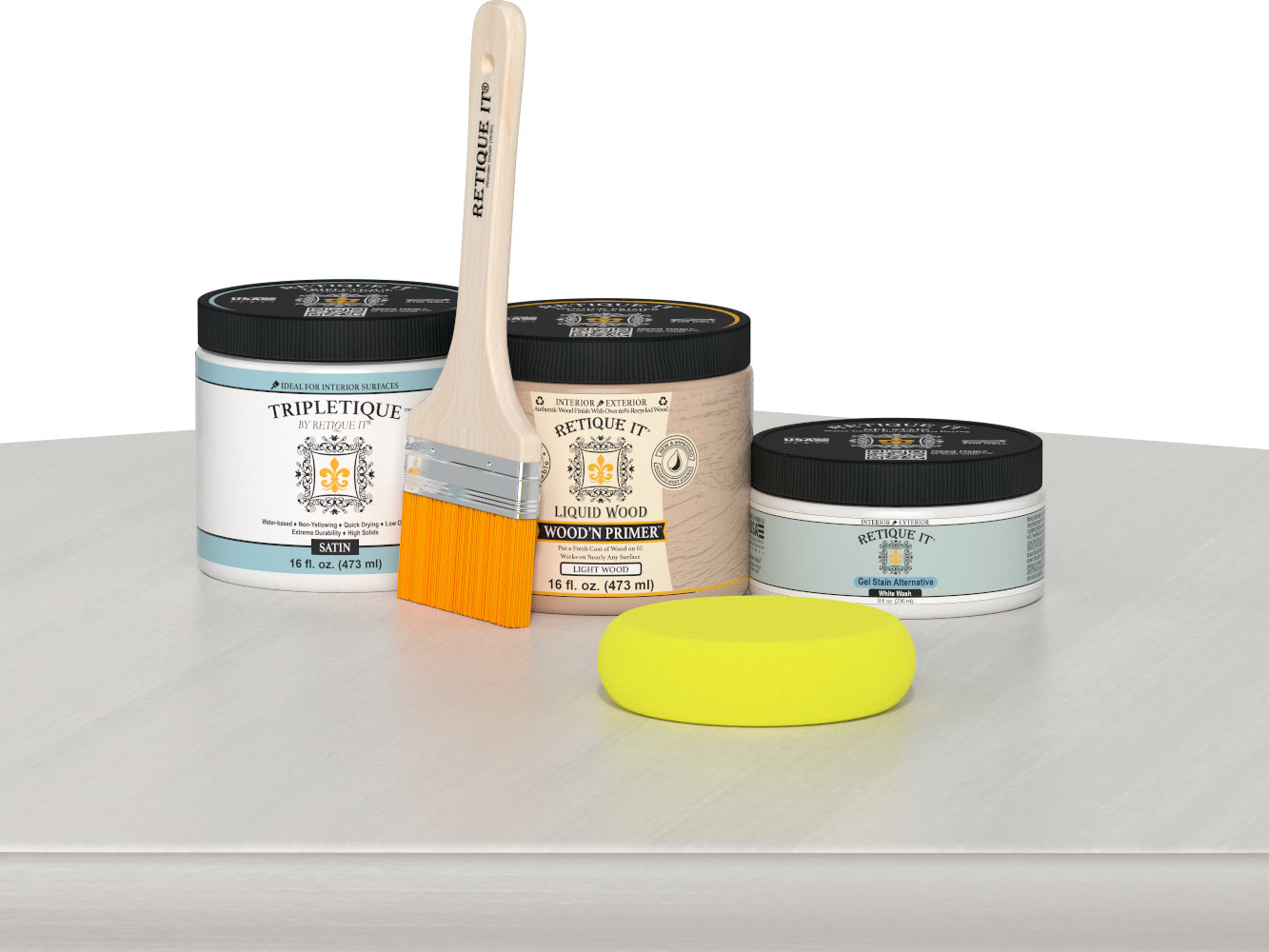 Retique It® White Wash Multipurpose Kit contents with Liquid Wood primer, White Wash gel stain alternative, Tripletique satin interior top coat, paintbrush, and yellow sponge displayed on a white wood surface.