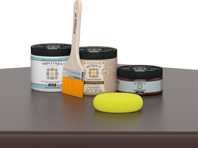 Retique It® Java Multipurpose Kit contents with Liquid Wood primer, Java gel stain alternative, Tripletique satin interior top coat, paintbrush, and yellow sponge displayed on a dark wood surface.