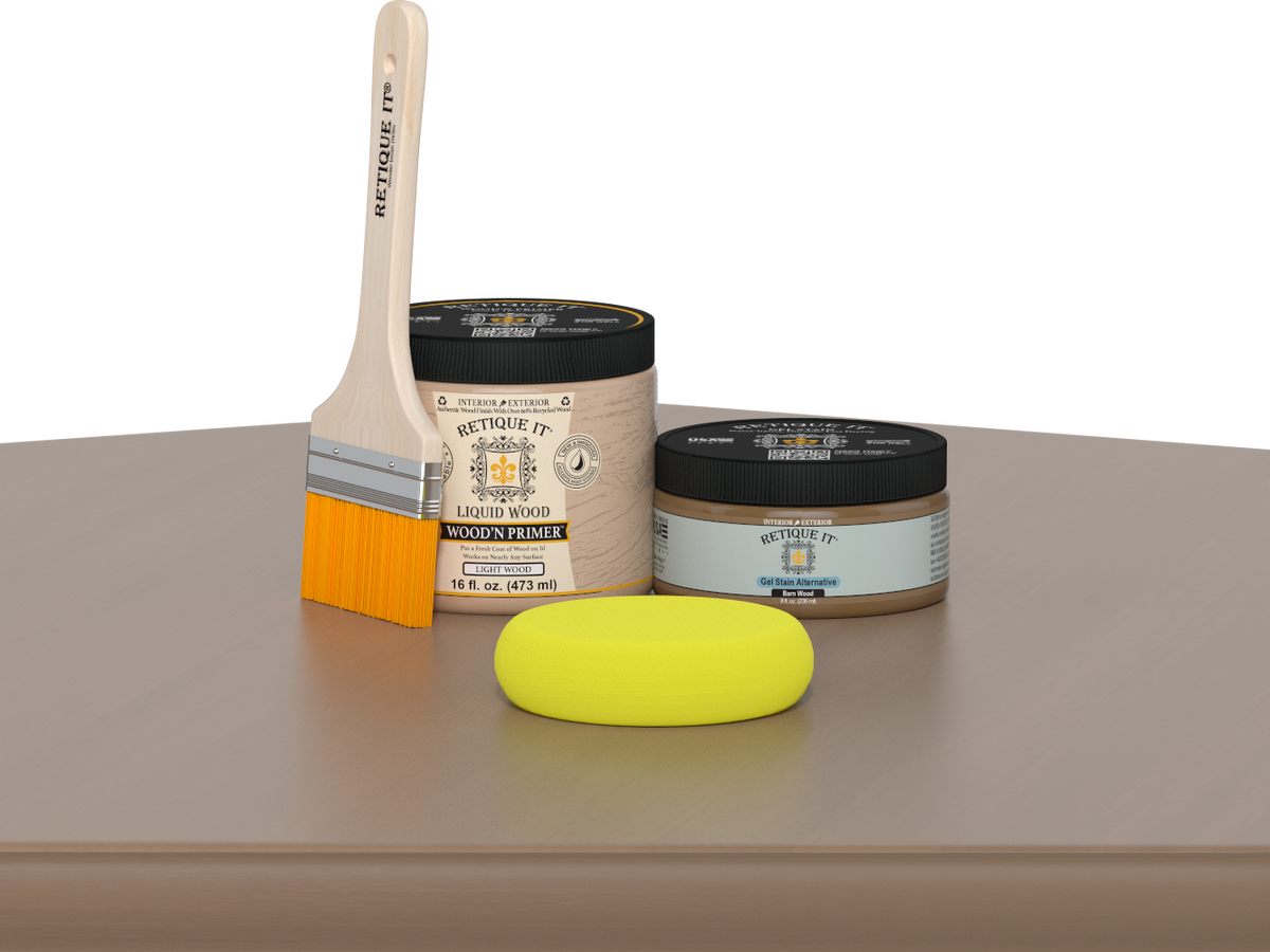 Retique It® Barn Wood Multipurpose Kit contents with Light Wood Liquid Wood primer, Barn Wood gel stain alternative, paintbrush, and yellow sponge displayed on a wood surface.