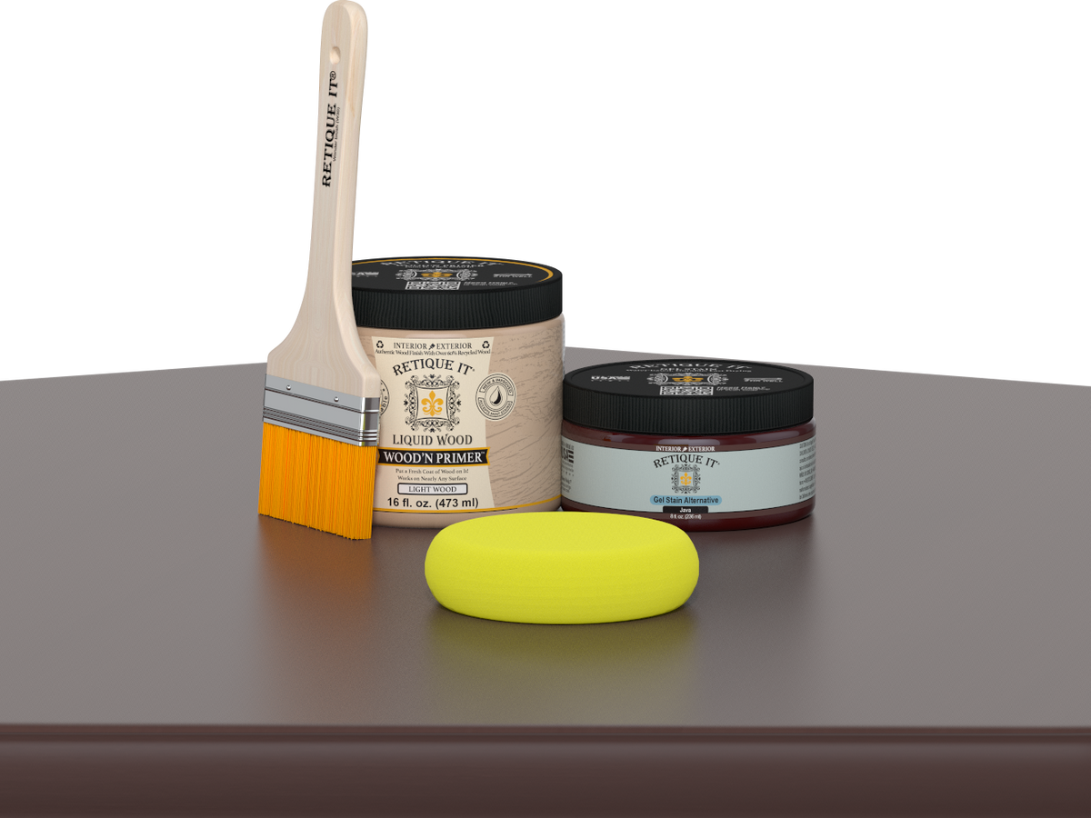 Retique It® Java Multipurpose Kit contents with Liquid Wood primer, Java gel stain alternative, paintbrush, and yellow sponge displayed on a dark wood surface.