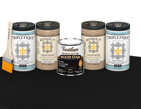 64 oz Retique It Liquid Wood kit with Ebony stain, matte Tripletique topcoat, and a paintbrush on a matching finished tabletop.