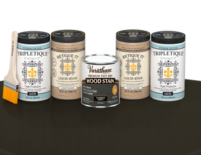 64 oz Retique It Liquid Wood kit with Carbon Gray stain, satin Tripletique topcoat, and a paintbrush on a matching finished tabletop.