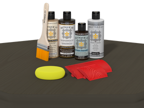 Retique It® Wood'n Finish Kit in charcoal for exterior wood projects, shown on a table with tools and wood surface.