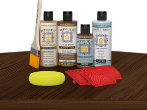 Retique It® Dark Oak Wood'n Kit with Light Wood Primer, Dark Oak Wood'n Stain, Satin TripleTique Top Coat, yellow sponge, red graining tool, and brush.