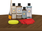 Retique It® Wood'n Kit Modern Walnut interior topcoat set displayed on table, showcasing wood finish application and kit components.