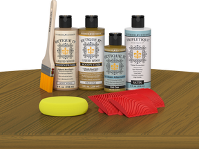 Retique It® Wood'n Finish Kit in Old Oak stain shown on a table, highlighting natural wood grain and finish application.
