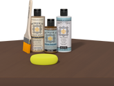 Retique It refinishing kit with Light Wood primer, Dark Oak gel stain alternative, matte Tripletique topcoat, a brush and yellow sponge.