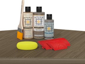Retique It Weathered Wood Fireplace Mantel Wood'n Finish Kit stain on a surface, showing the weathered wood texture and color.