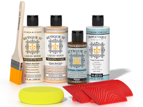 Retique It® White Oak Wood'n Kit with Bleached Wood primer, Pickled Oak stain, Pecan gel stain alternative, Matte Tripletique® Top Coat, brush, red graining tool, and yellow sponge.