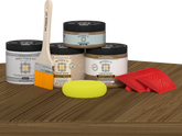 Retique It Wood'n Kit (Med) barn wood exterior topcoat with brushes and applicator on table for multi-purpose wood finishing.