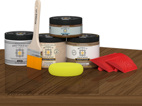 Retique It® Wood'n Finish Kit in Modern Walnut with exterior topcoat, featuring wood finish application tools on a table.