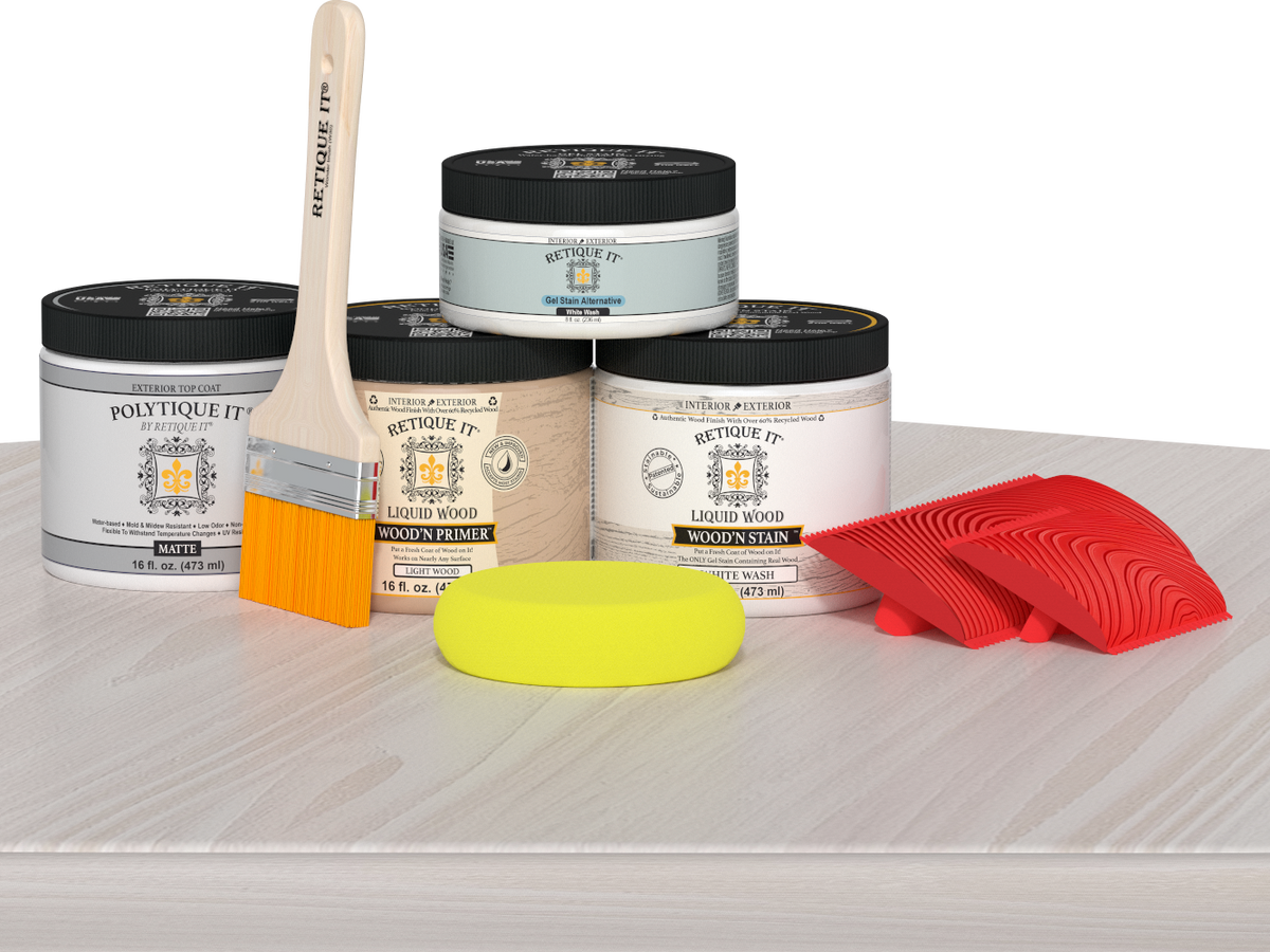 Retique It Wood'n Finish Kit in White Wash, medium size, with exterior top coat and wood finish tools on a table.