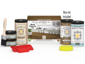 Retique It® Wood'n Finish Kit with four large stains in barn wood color, featuring stain bottles and finishing tools on a tabletop.