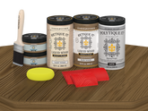 Retique It Barn Wood refinishing kit with product containers, brush, graining tools, and sponge.