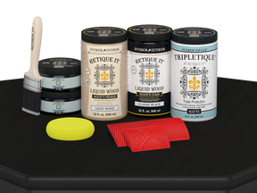 Large Black Wood'n Finish Kit by Retique It® with matte interior top coat and wood finishing tools on a table.