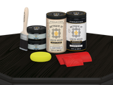 Retique It Wood'n Cabinet Kit in classic black with 12 grained door stains, displayed on a table for cabinet renovation.
