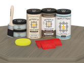 Retique It Wood'n Finish Kit in Drift Wood with four large stains, featuring matte finish on a tabletop surface.