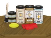 Retique It® Wood'n Finish Kit with four large Old Oak stain samples on a tabletop in matte finish.