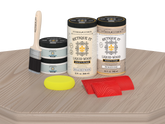 Retique It Wood'n Finish Front Door Kit (Double) in Sun Bleached color, displayed on table with wood grain details.