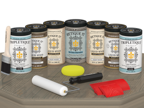 Retique It® Wood'n Cabinet Kit with drift wood stain, 24 grained cabinet doors, glossy finish, displayed on a table.