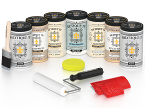 Retique It Sun Bleached finishing system with PolyTique It Matte top coat, featuring Liquid Wood Wood'n Primer in Bleached Wood, Liquid Wood Wood'n Stain in Pickled Oak, White Wash Gel Stain Alternative, paintbrush, roller, yellow sponge, red graining tools, and protective matte finish products for creating a weathered sun-bleached wood look.