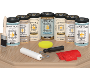 Retique It® Wood'n Cabinet Kit with 24 white oak stained, grained cabinet doors in satin finish, displayed on a table.
