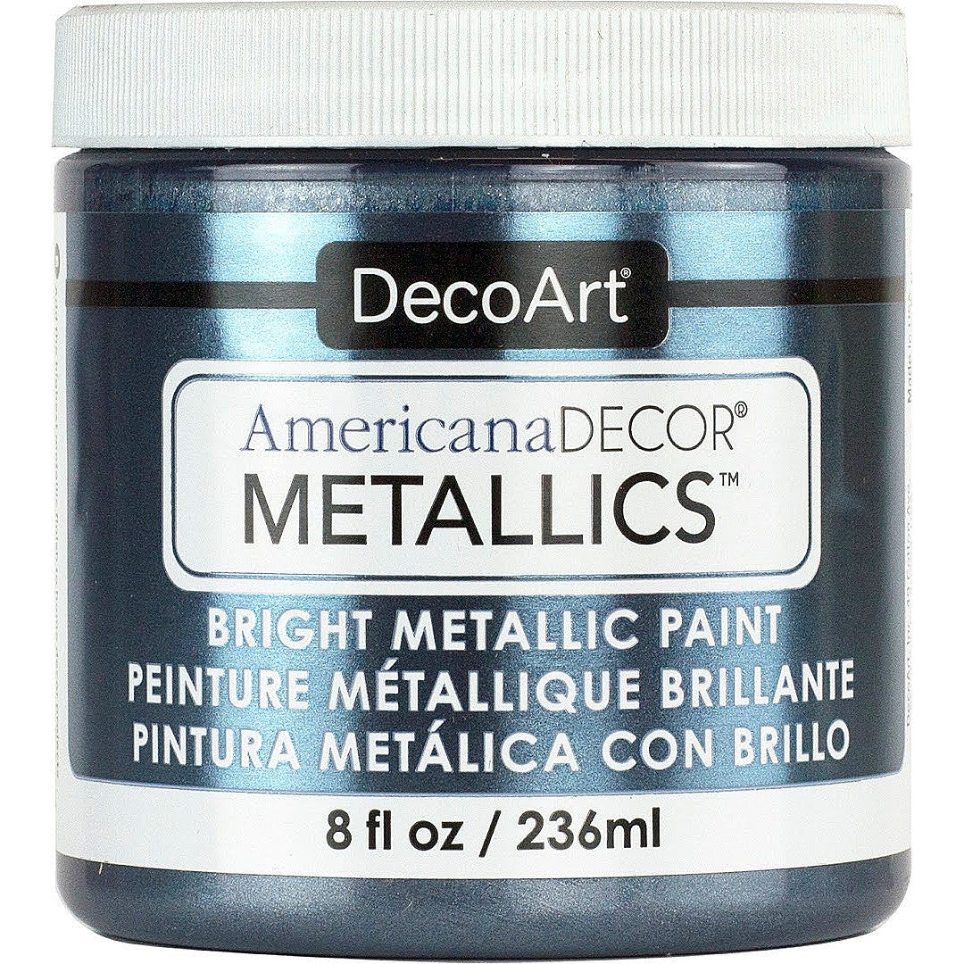 DecoArt Americana Decor Metallics pearl metallic paint in 8 oz bottle showing a smooth, shiny pearl finish on a craft surface.